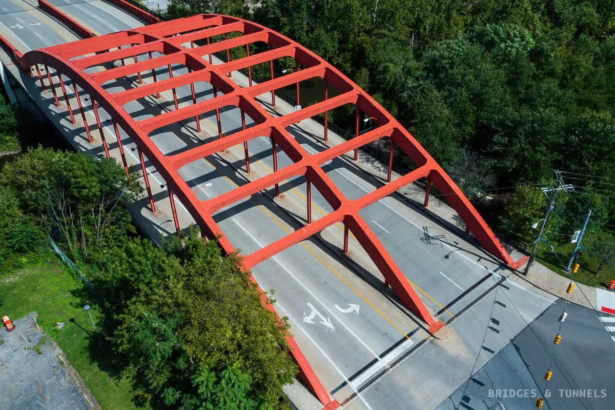 Red arch bridge in Youngstown from above